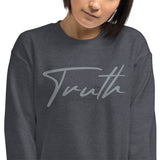 Close Up Of A Woman Wearing A Heather Grey Truth Sweatshirt