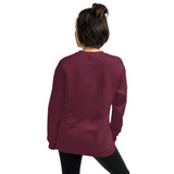 Back View Of A Woman Wearing A Maroon Truth Sweatshirt