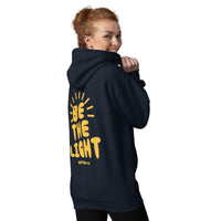 Woman Wearing A Navy Be The Light Hoodie