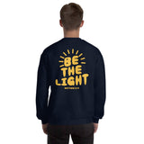 Man Wearing A Be The Light Sweatshirt In Navy