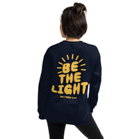 Woman Wearing A Navy Be The Light Sweatshirt