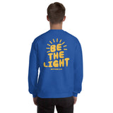 Man Wearing A Royal Blue Be The Light Sweatshirt