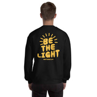 Man Wearing A Black Be The Light Sweatshirt