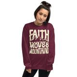 Woman Wearing A Maroon Faith Moves Mountains Sweatshirt