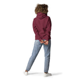 Back view Of A Woman Wearing A Maroon Forgive Hoodie