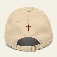 Beige cap with a red cross on a beige background
