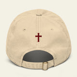 Beige cap with a red cross on a beige background