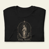 Black t-shirt with a graphic of a religious figure OF OUR LADY OF GUADALUPE and 'Hail Mary' text