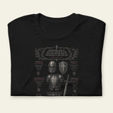 Black t-shirt with armor graphic and text on a beige background